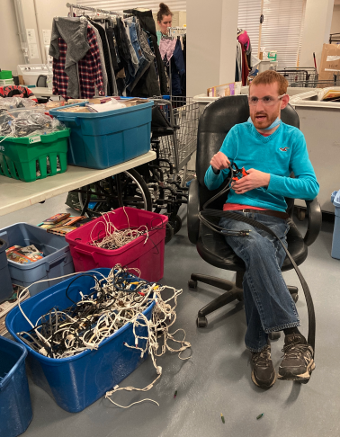 Denny Belliveau recycling old Christmas lights.