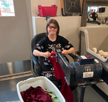 Jenny MacNevin operating the rag cutter