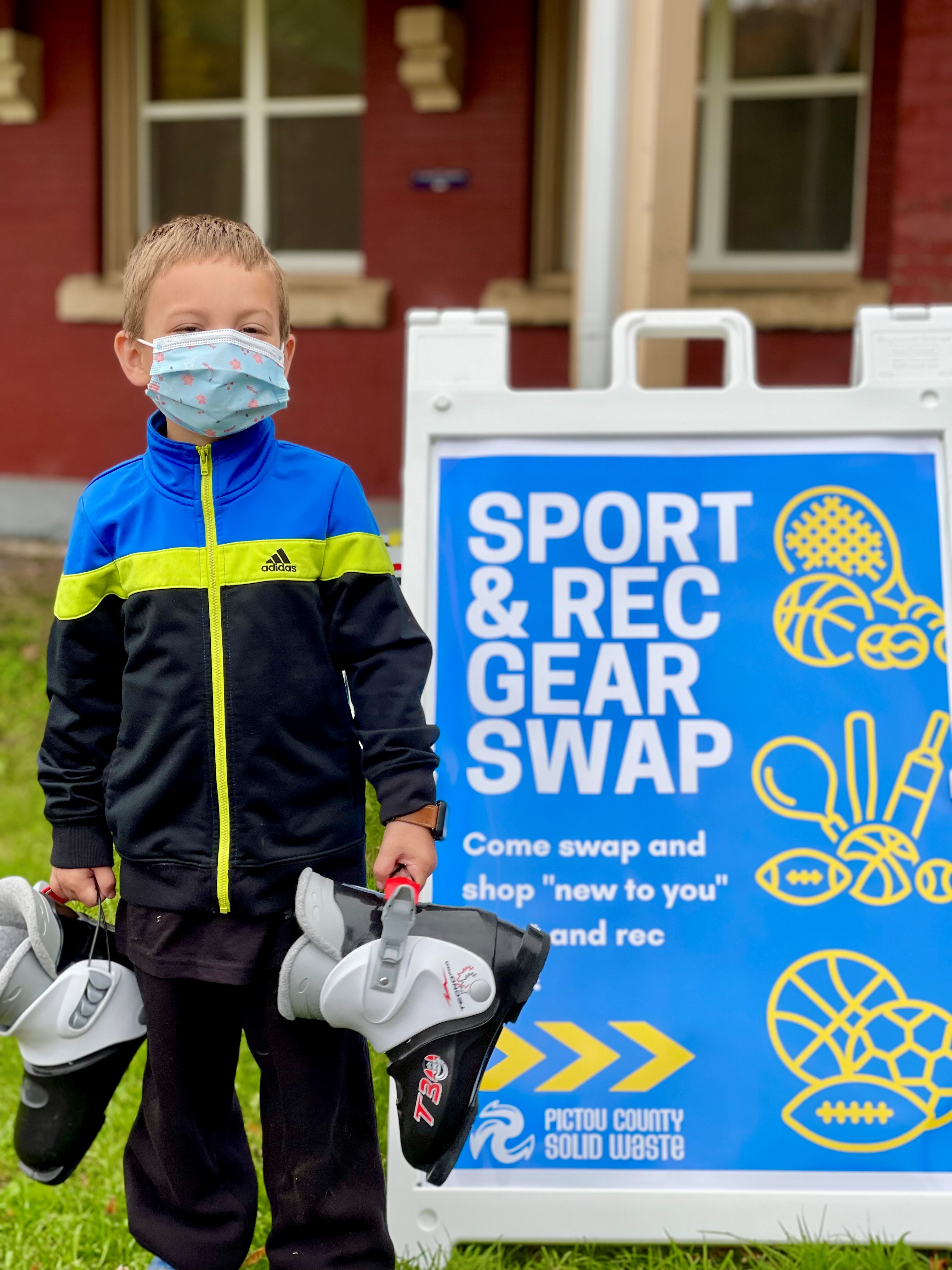 Boy swapping skates at community waste reduction week event