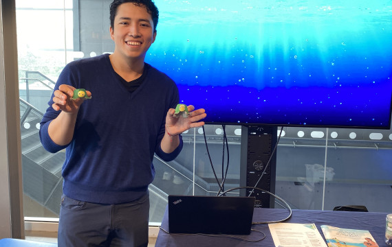 Gerardo at a booth at the discovery centre