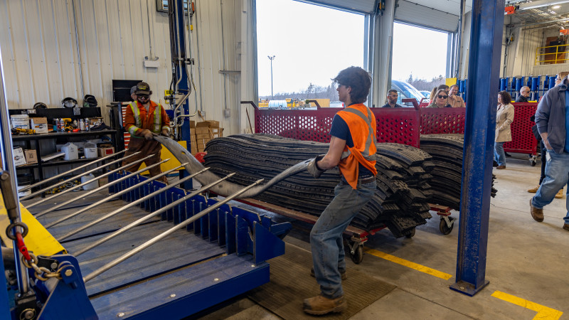2 people working at a warehouse to create blasting mats