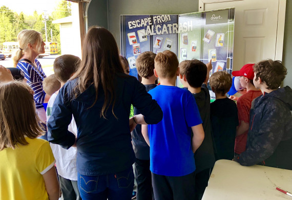 a group of children observing the escape from alcatrash booth